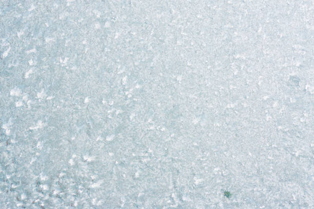 istock Frozen winter abstract background on the window glass with copy space 1098425216