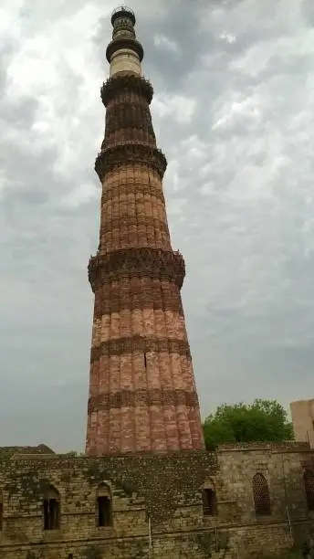 73 m tall tapering tower of five storeys made of red sandstone..