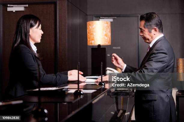 Checking In Stock Photo - Download Image Now - Hotel Reception, Japanese Ethnicity, Hotel