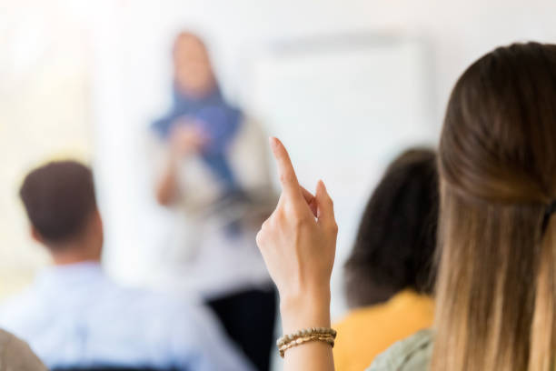 istock Unrecognizable woman asks question during meeting 1098428334