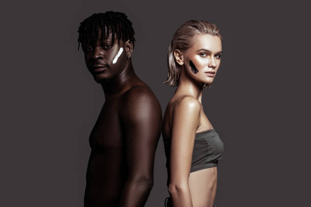 istock Slim model posing sideways near African-American man 1098430530