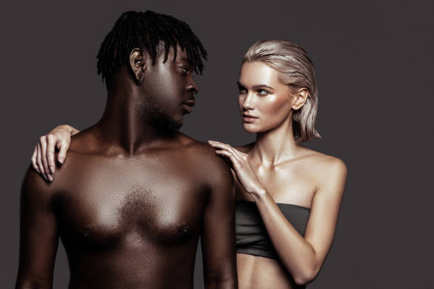 istock African-American model with dreadlocks looking at his colleague 1098430664