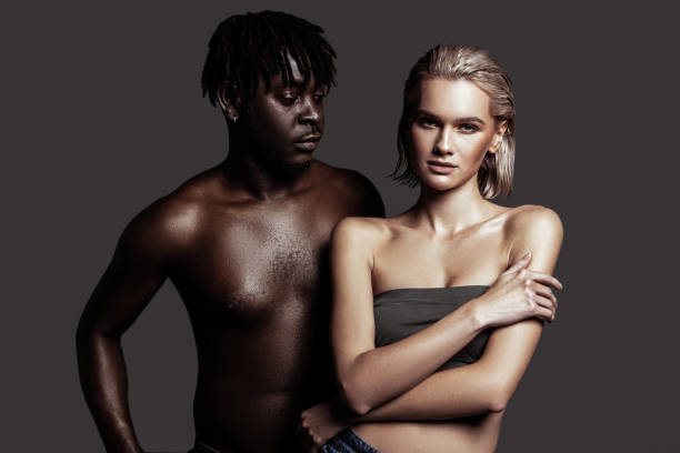 istock Model with dreadlocks looking at his lovely beautiful colleague 1098431402