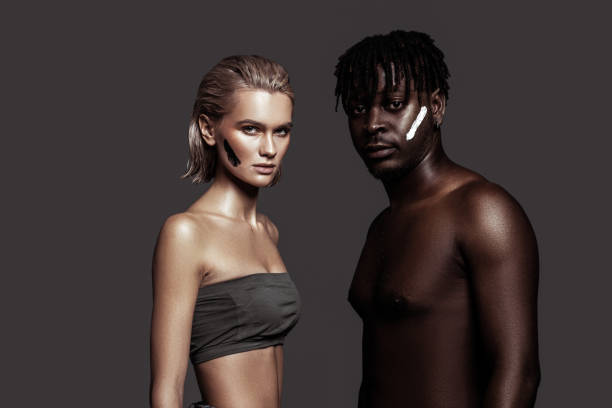 Different color. Slim appealing international models with different skin color posing together