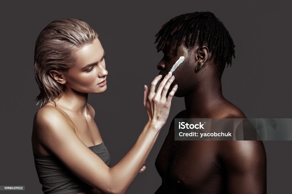 Model Using Cream Two Models Using Face Cream While Promoting Cosmetics Stock Photo ...