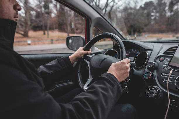 istock Man driving safely inside the car 1098432224