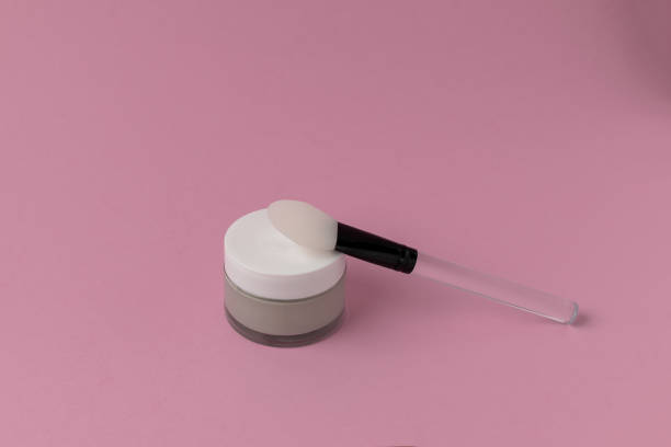 istock Face mask with silicone spatula, pink background 1098433474