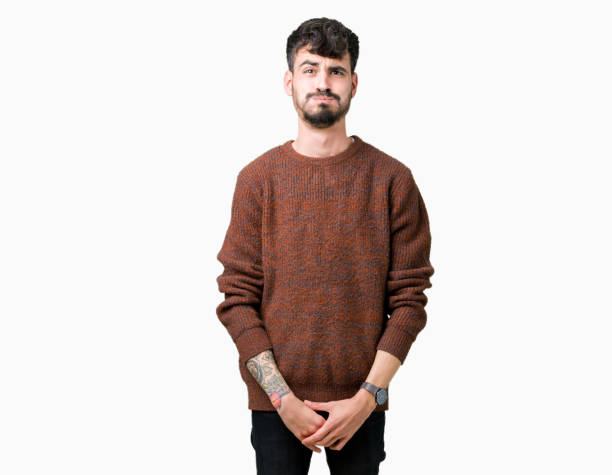 istock Young handsome man wearing winter sweater over isolated background puffing cheeks with funny face. Mouth inflated with air, crazy expression. 1098439706
