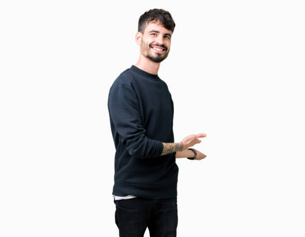 istock Young handsome man over isolated background Inviting to enter smiling natural with open hand 1098440058