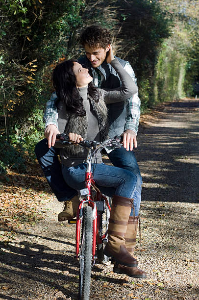 Happy Young Couple In Love Cycling Stock Photos, Pictures & Royalty-Free  Images - iStock
