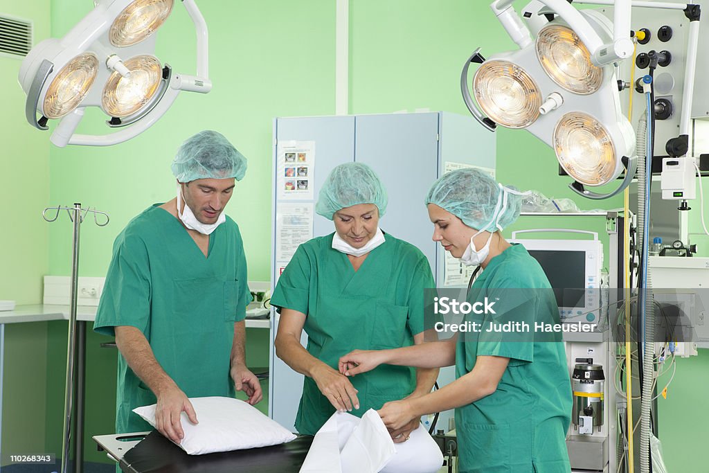 Medical team in scrubs preparing room  Nurse Stock Photo