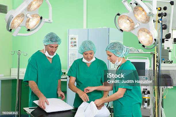 Medical Team In Scrubs Preparing Room Stock Photo - Download Image Now - Nurse, Hospital, 20-24 Years