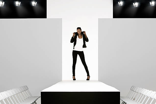 Model with black leather jacket on catwalk at fashion show  catwalk stage stock pictures, royalty-free photos & images