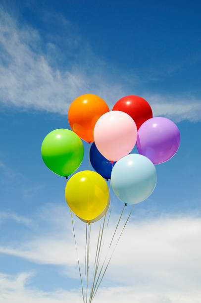istock Colorful Party Balloons Bunched Against a Blue Sky 110706282