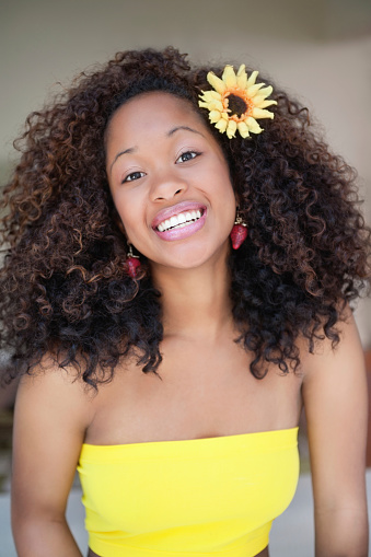 Portrait of young smiling African American woman with curly hair
