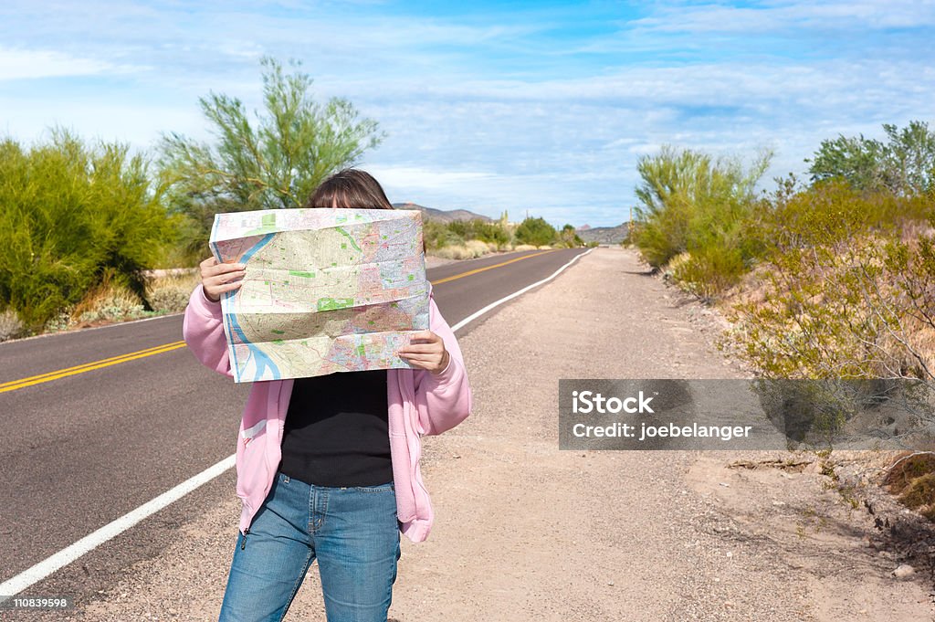 Woman reading roadmap  Road Map Stock Photo