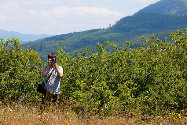 Photographer in the mountains stock photo