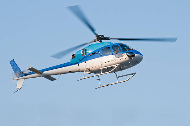 istock Helicopter in flight against blue sky 110844746
