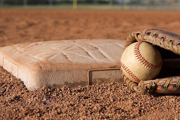 istock Baseball and Glove near a Base 110849309