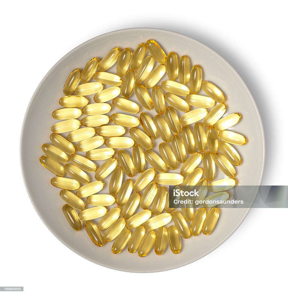 Capsule placcatura in oro - Foto stock royalty-free di Astratto