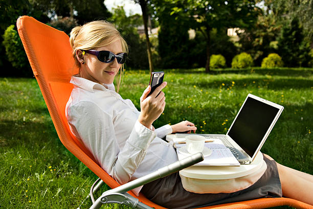 istock young woman working outside on computer and drinking coffee 110858083