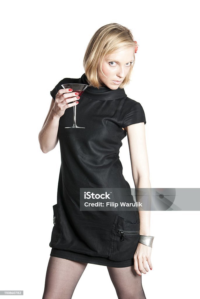 Young attractive woman holding a glass of red wine Young attractive woman in black dress holding a glass of red wine. Studio photo of blonde woman on white background. Adult Stock Photo