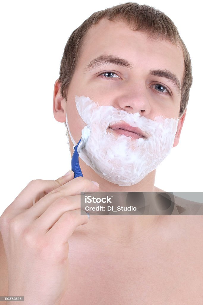 Jeune homme rasage avec le Rasoir - Photo de Adulte libre de droits