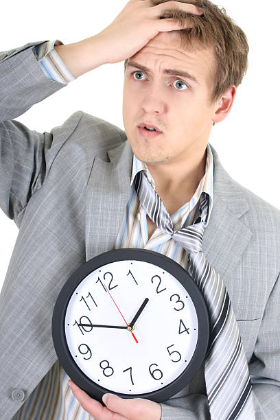 istock Amazed businessman in grey suit holding a clock 110872676