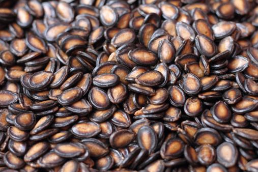 Closeup shot of black melon seeds in the market.