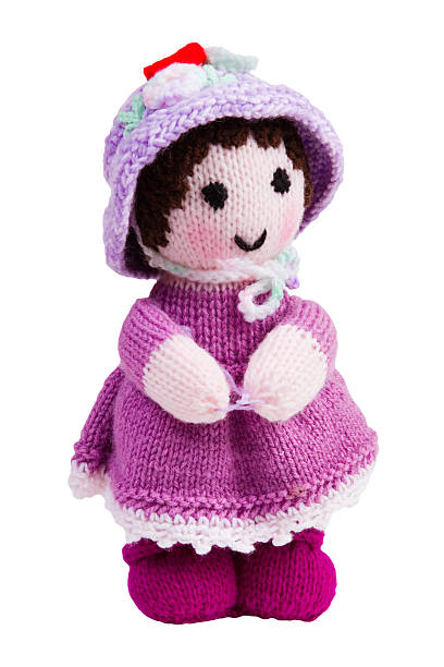 Handmade knit toy, pink doll in her hat and dress