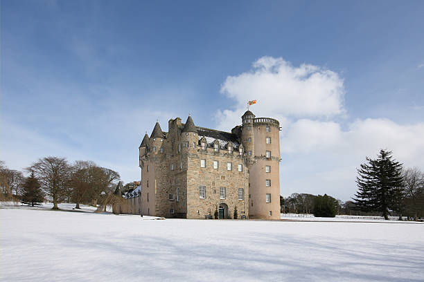 Castle Fraser in the snow on a clear winter day