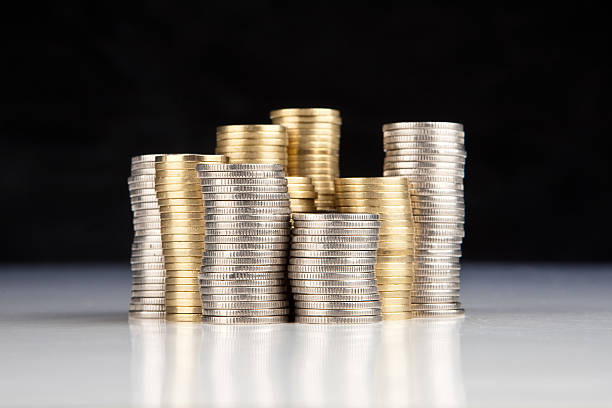 stack of silver and gold coins stock photo