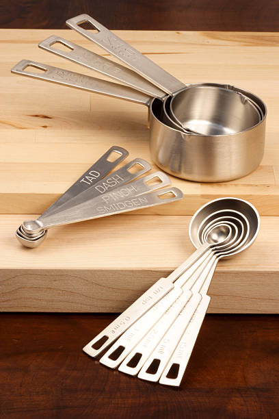 istock kitchen utensils over wood station 110894230