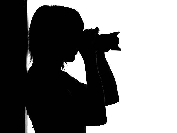 istock Silhouette of woman with photo camera 110896331