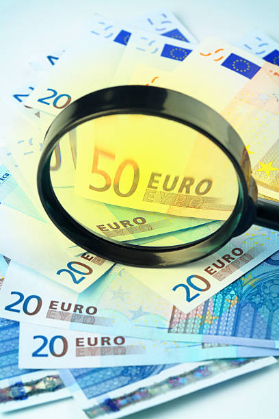 istock Euro currency under a magnifying glass 110896389