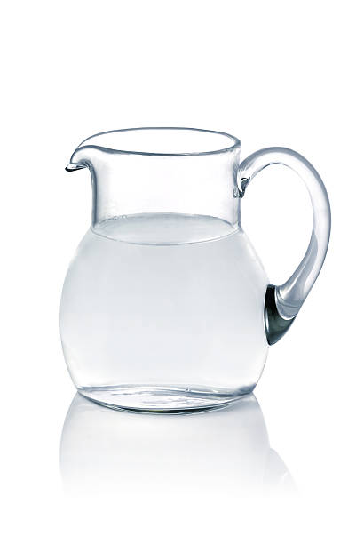 istock Glass jug filled with water on a white table 110898422
