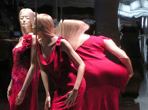 Mannequin in red at window display