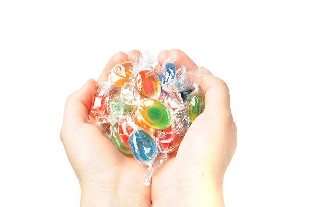 Hands with candies stock photo