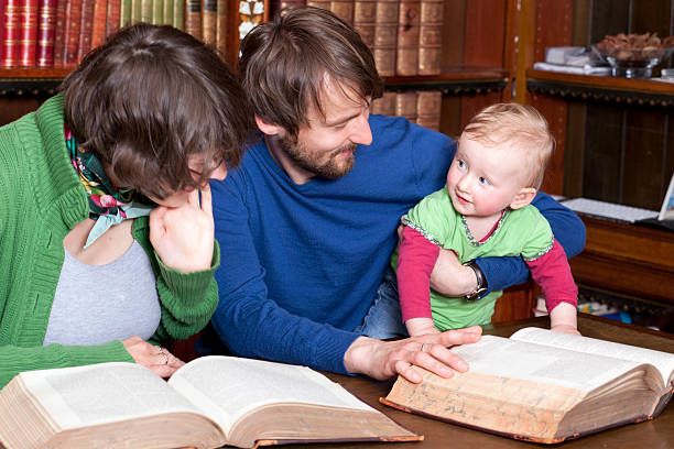 istock Happy family with a baby in classic library 110904749