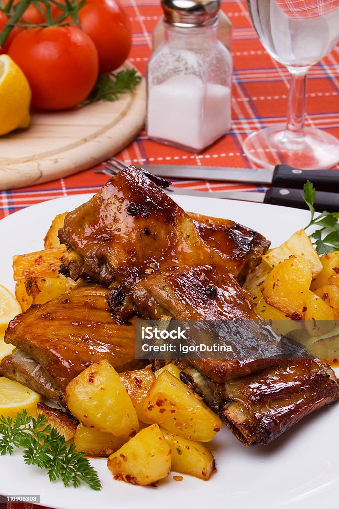 Grilled ribs with baked potato  Baked Stock Photo