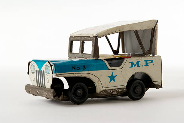 istock Isolated shot of rusty tin toy Jeep on white background 110918554