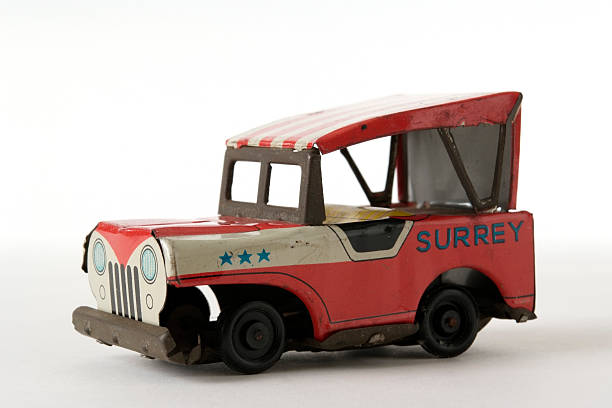 istock Isolated shot of rusty tin toy Jeep on white background 110918564