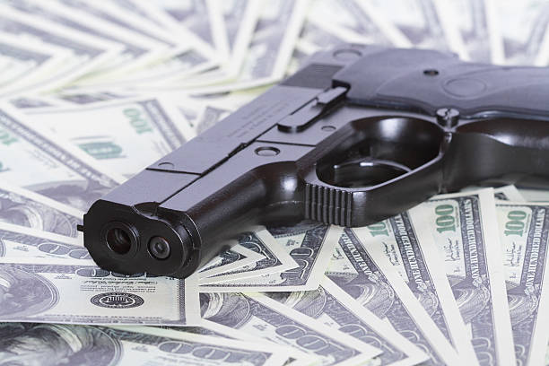 istock Gun and money 110926971