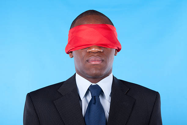 blindfold african businessman stock photo