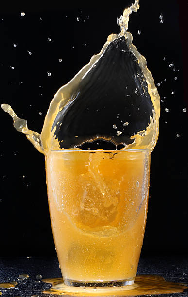 istock flaming splash of mango juice. 110932024