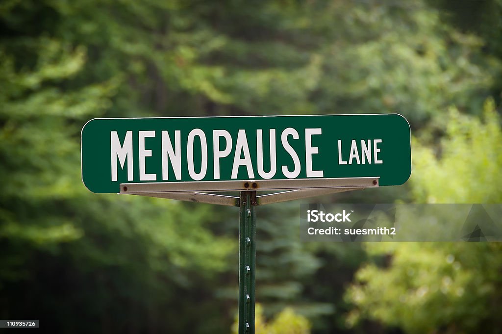 Menopause Lane Street Sign Green street sign with white letters for Menopause Lane. Use it for humor regarding middle age for women. Menopause Stock Photo