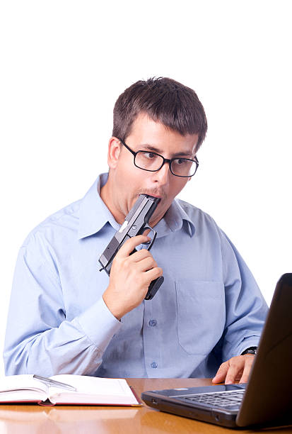 Suicidal young businessman stock photo