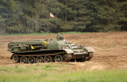 outdoor scenery with a old tank of the 