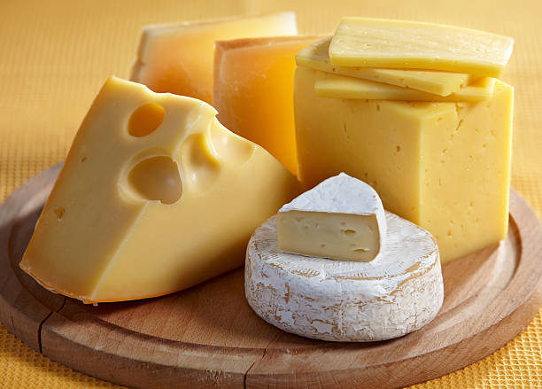 istock Various types of cheese on a wooden cutting board 110949989