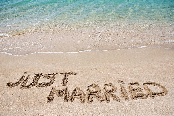 Just Married written on the sand stock photo